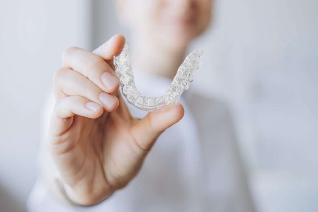 Invisalign vs Porcelain Veneers: Which Path Leads to Your Best Smile?